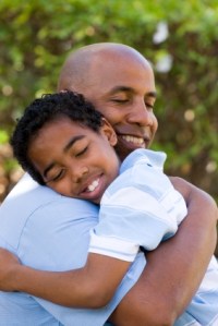 Father and son hugging