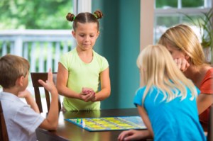 Family playing board game