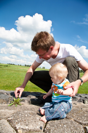 Father and baby exploring outside