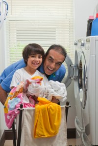 Father and son doing laundry