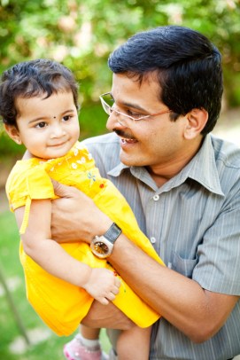Indian father playing with her little daughter showing affection