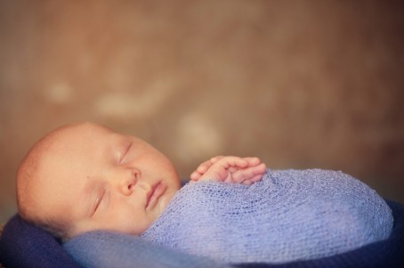 Newborn baby in basket