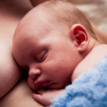 Newborn sleeping on mother skin to skin