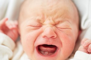 Newborn baby is crying - selective focus