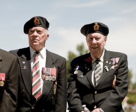 "Milton, Canada- July 1, 2011: Canadian war veterans of various ages gather to watch new citizenship ceremony in Milton, Ontario, Canada. The ceremony involved the swearing in of new Canadian citizens and took place on Canada Day, July 1st, 2011. The veterans dressed in ceremonial garments, decorated in medals awarded to them during their respective tours of duty in various divisions of the Canadian forces."