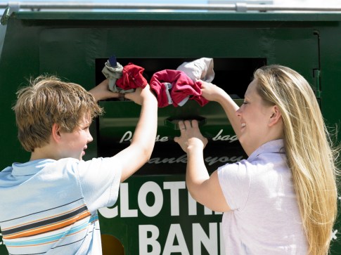 Woman and boy donating clothing