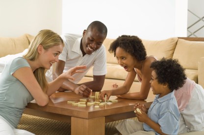 Family playing with dominoes