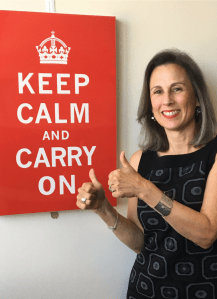 Jennifer giving the thumbs-up sign in front of her Keep Calm and Carry on poster