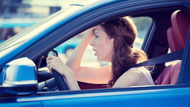 displeased stressed female car driver